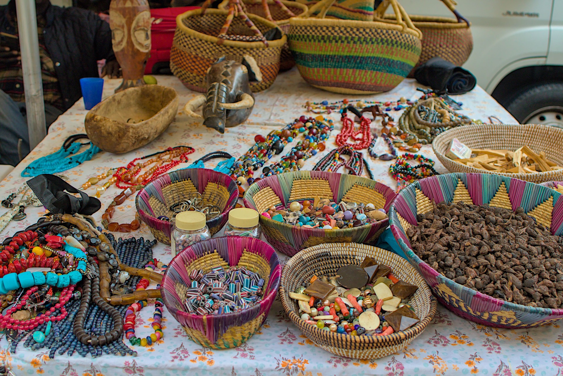 A colorful market stall displays a variety of handcrafted goods.